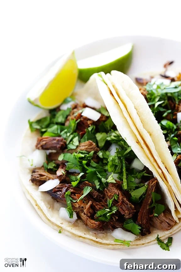Slow Cooker Barbacoa, shredded and ready for serving in tacos or bowls.
