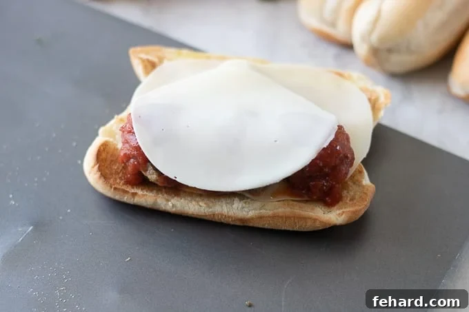 Meatball Sub Sandwich: Final cheese layer Additional provolone cheese placed on top of meatballs for a truly cheesy sub.