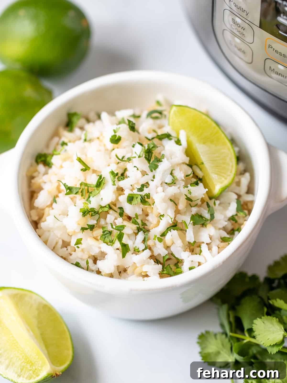 A bowl of fresh cilantro lime rice next to an Instant Pot, ready to serve.