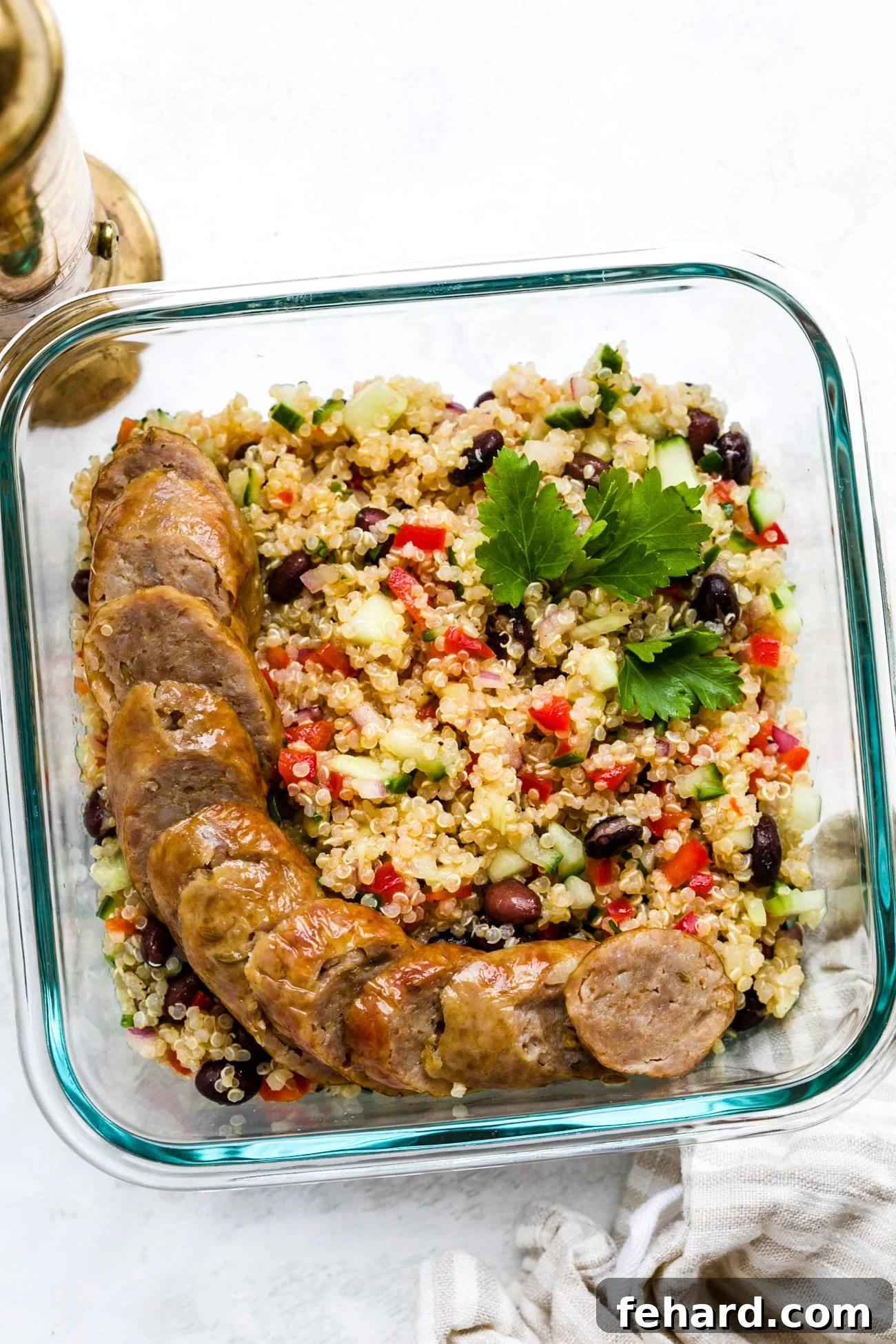 Another view of quinoa salad portioned into clear meal-prep containers, highlighting its suitability for healthy eating on the go.