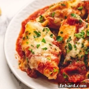 Stuffed Shells served on white plate.