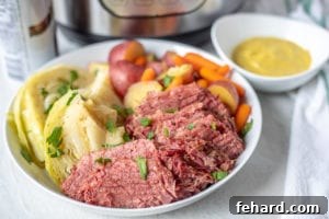Corned Beef, Cabbage, Potatoes and Carrots in white serving platter