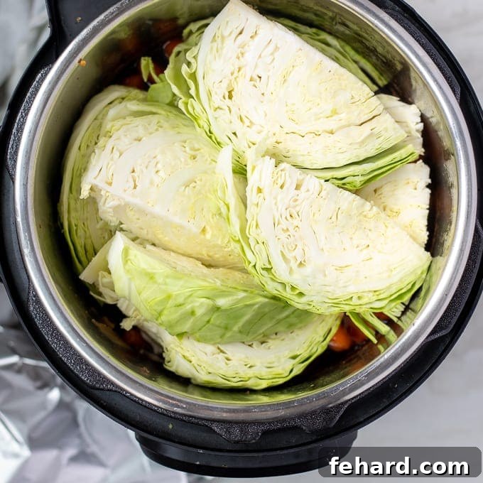Potatoes, Carrots, and Cabbage cooking together in the Instant Pot.