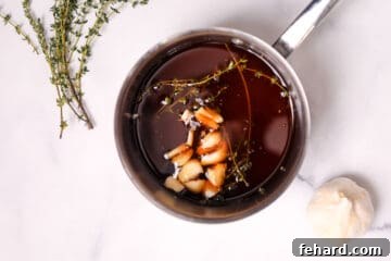 Ingredients for brandy au jus in stock pan.