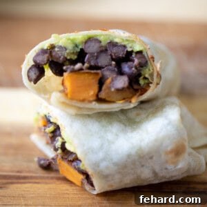Burrito filled with black beans, sweet potatoes and avocado.