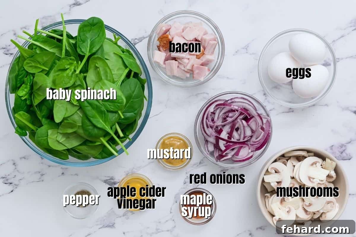 Key Ingredients for Bacon Spinach Salad Arrangement of fresh spinach, raw bacon, whole hard-boiled eggs, red onions, and mushrooms on a kitchen counter, ready for preparation.