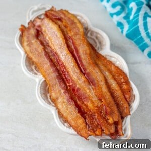 Crispy Oven Baked Bacon on White Plate