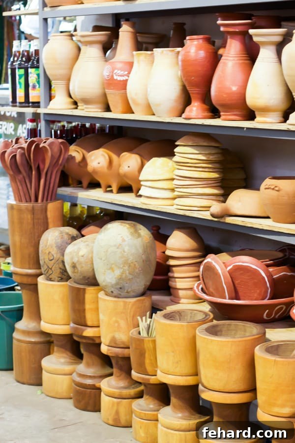 Racks of terracotta pottery and wooden utensils at a farmers' market in Brazil. 