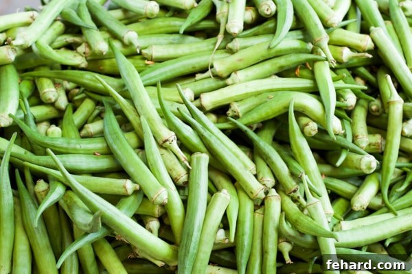 A closeup of a large pile of bright green okra. 