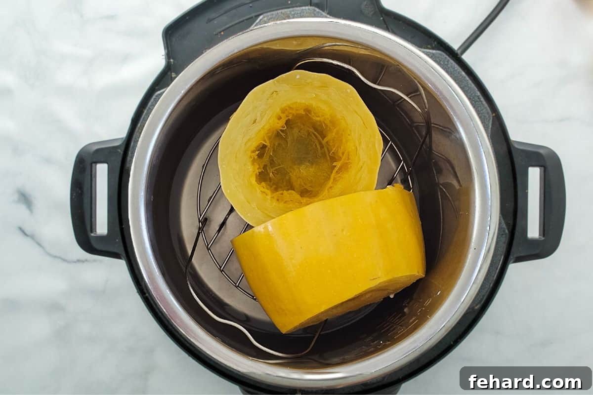 How to Cook Spaghetti Squash Spaghetti Squash with ends cut off and cut in half widthwise on trivet inside inner pot.