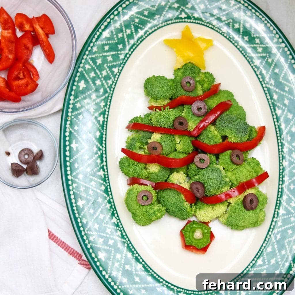 Christmas tree vegetable platter with yellow star. A healthy and visually appealing snack shaped like a Christmas tree.