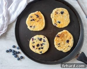 Egg Free Blueberry Pancakes on Griddle.