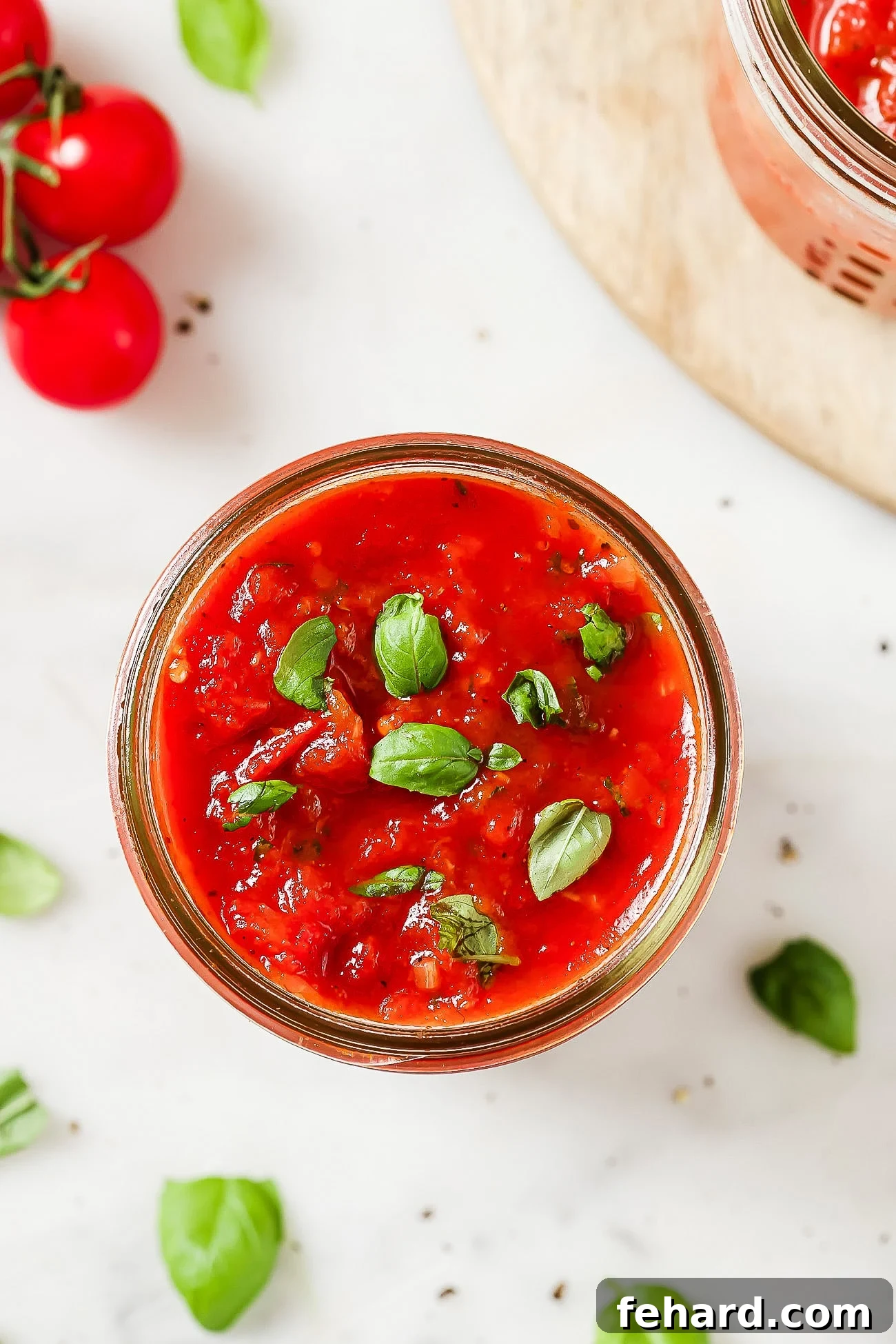 The Secret to Perfect Homemade Tomato Sauce 11 An overhead shot of homemade tomato sauce in a mason jar, showcasing its rich texture and inviting appearance.