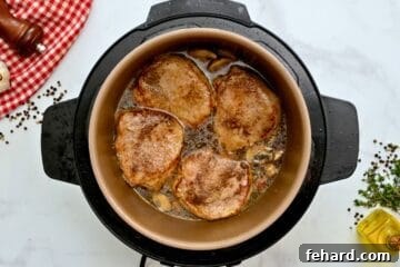Seared Pork Chops pressure cooked with beef stock and mushrooms.