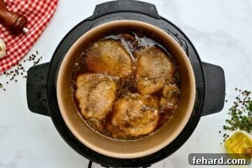 Pressure Cooked pork in gravy inside inner pot.