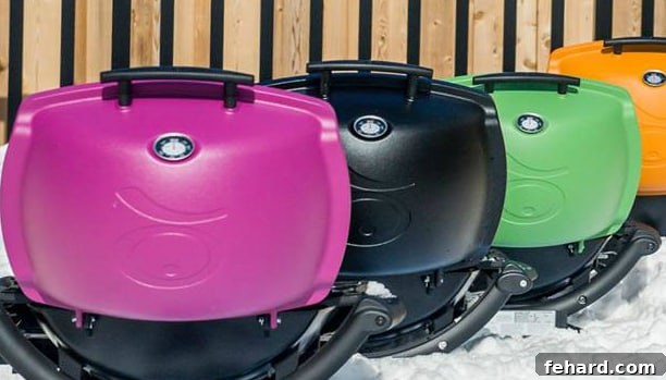 A vibrant and inviting display of four brand-new Weber Q1200 grills in eye-catching pink, classic black, fresh green, and energetic orange, eagerly awaiting their new homes.