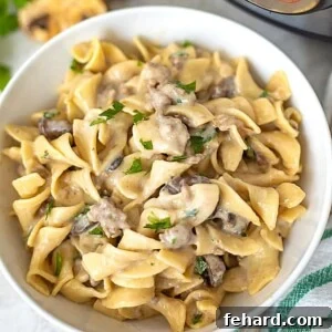 Quick and Creamy Instant Pot Beef Stroganoff 2 Instant Pot Beef Stroganoff in White Bowl with homemade mushroom gravy and egg noodles.