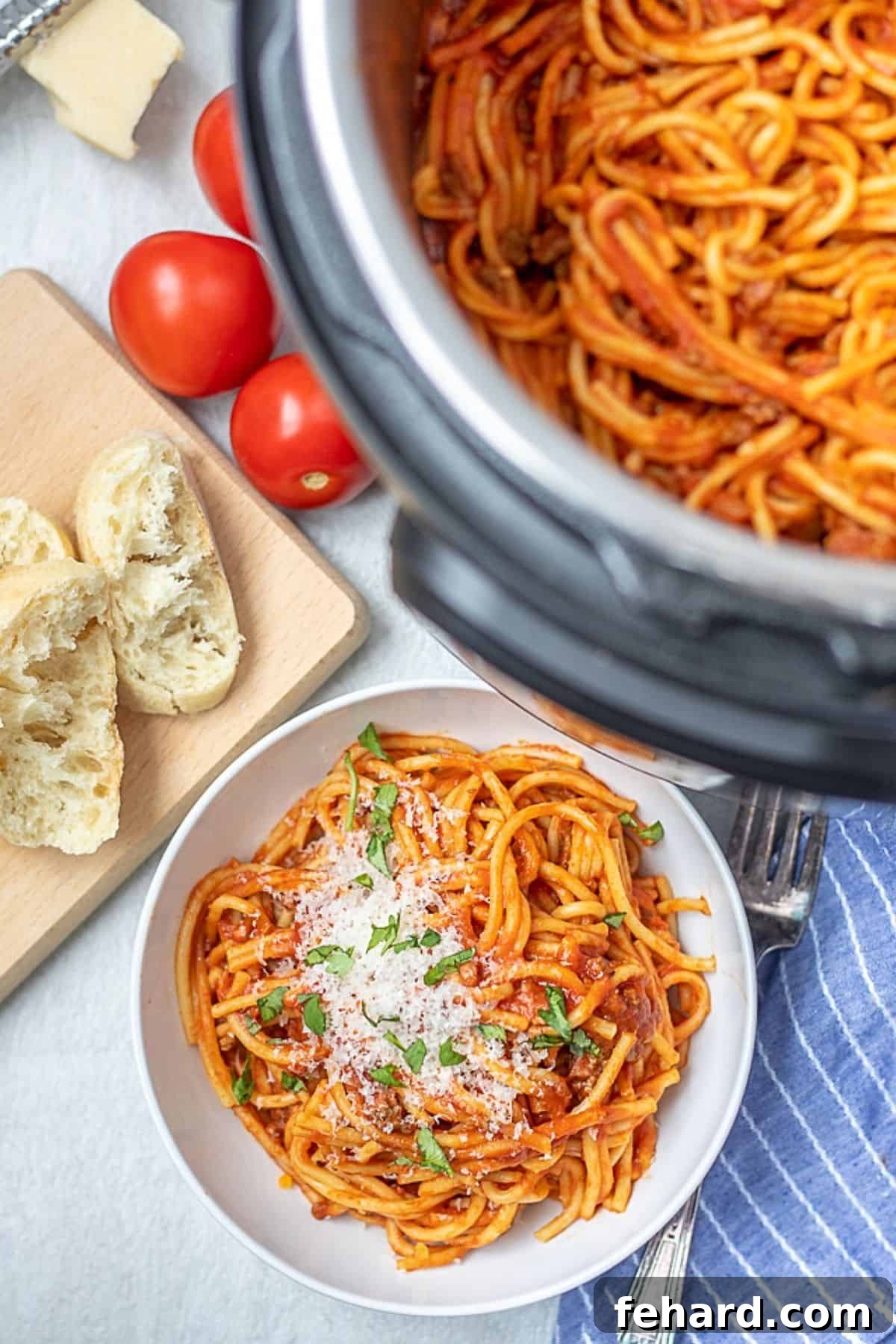 A generous serving of Instant Pot Spaghetti in a pristine white bowl, garnished with fresh parsley and a dusting of Parmesan cheese, positioned next to an Instant Pot. The inner pot is also visible, showcasing the remaining spaghetti.