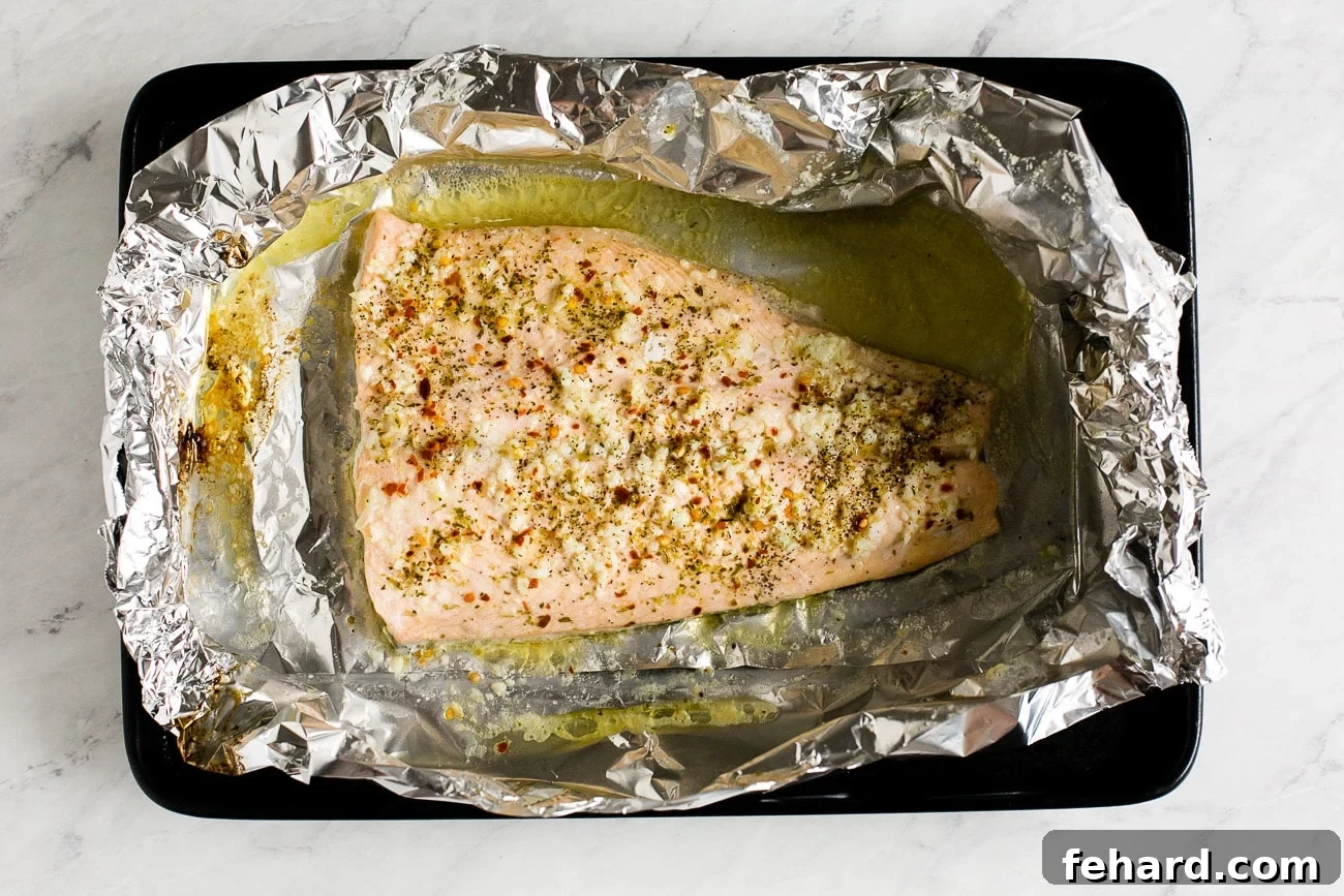 Overhead view of the perfectly cooked fish nestled in its foil packet, ready to serve.