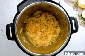 Caramelized Onions inside inner pot after being sauteed in butter and olive oil with shallots and thyme.