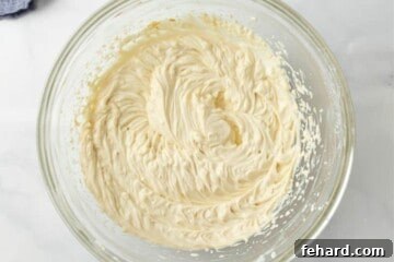 Mixing bowl showing cheesecake batter after mixing.