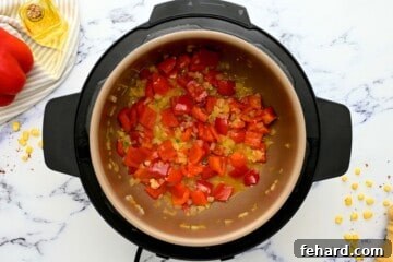 Red bell pepper, and onions sauteed together in inner pot.