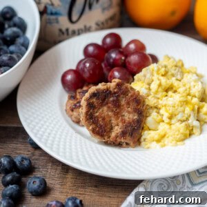 Breakfast Sausage on white plate with scrambled eggs