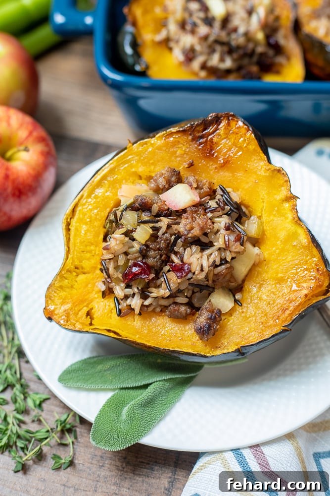 Beautifully roasted acorn squash halves filled with a delicious wild rice and sausage stuffing, garnished with fresh herbs.