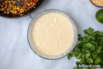 Mixing bowl with cornbread topping and tamale filling off to side.