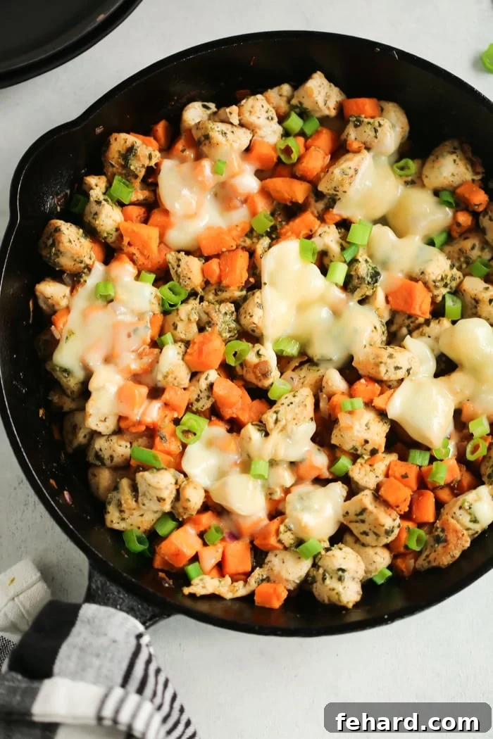 Sweet Potato Chicken Pesto Skillet - Quick, healthy, and incredibly flavorful, this one-pan meal is a weeknight game-changer. Overhead view of Sweet Potato Chicken Pesto in a cast iron Skillet, showcasing a complete and ready-to-serve meal