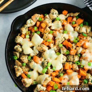 Pesto Chicken and Sweet Potato One-Pan Wonder 3 Sweet Potato Pesto Chicken Skillet with melted cheese and fresh green onions