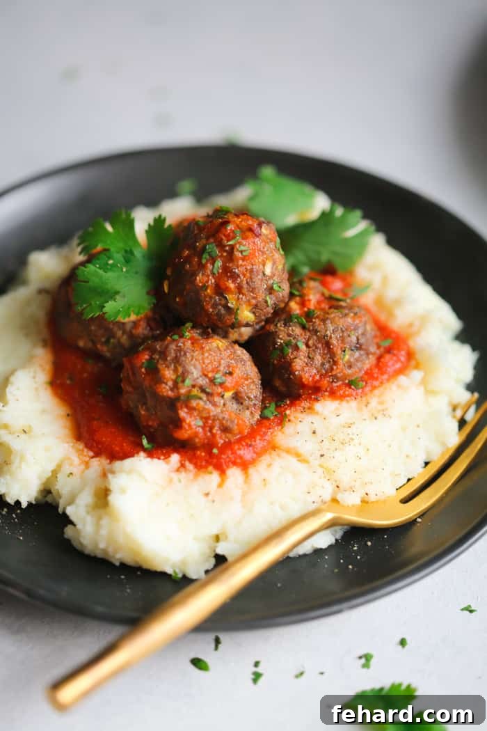 Creamy Mashed Cauliflower Recipe A bowl of creamy Mashed Cauliflower, perfectly smooth and ready to complement the turkey meatballs
