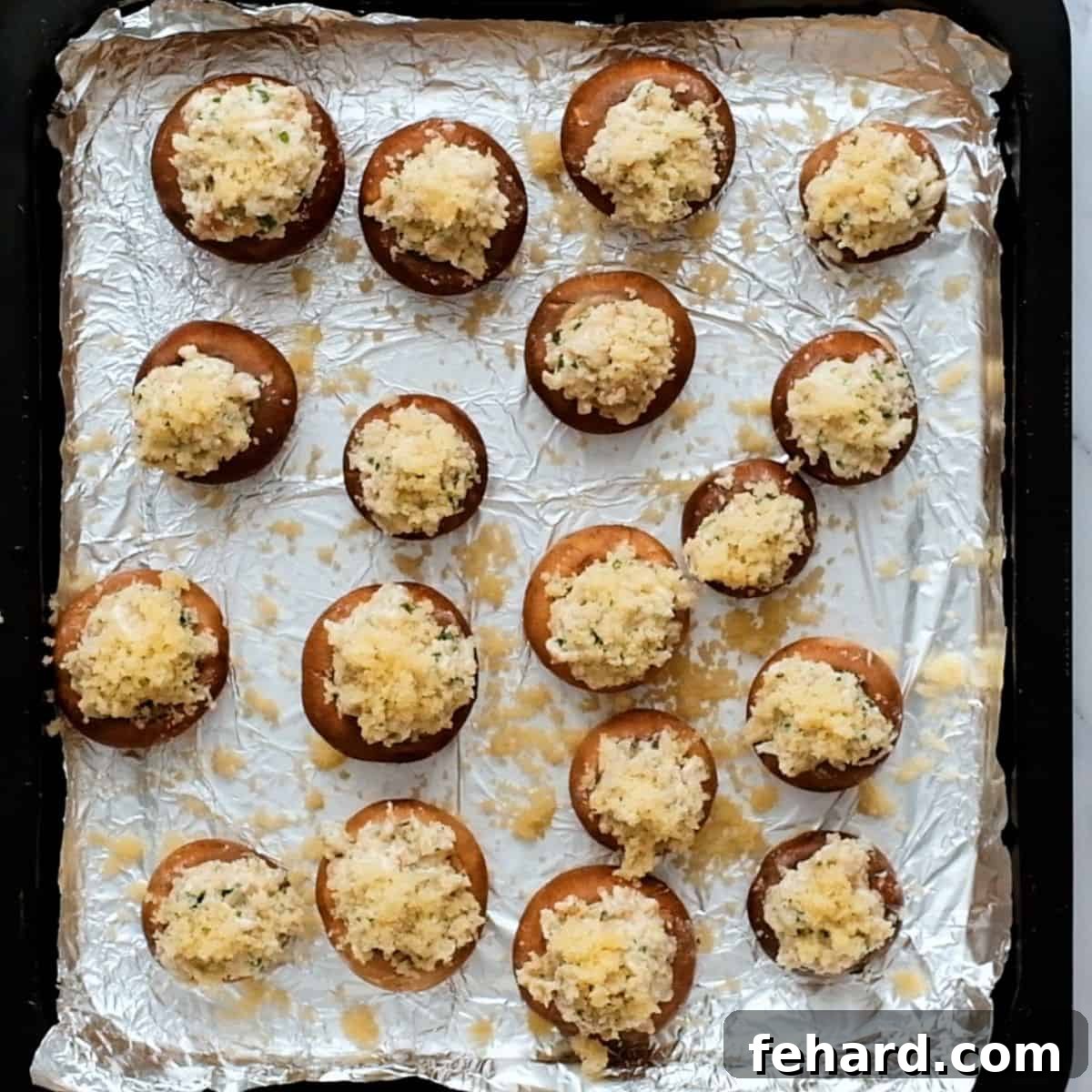 Cheese Stuffed Mushrooms with Panko Topping A baking tray filled with perfectly stuffed mushrooms, topped with golden breadcrumbs, ready for the oven.