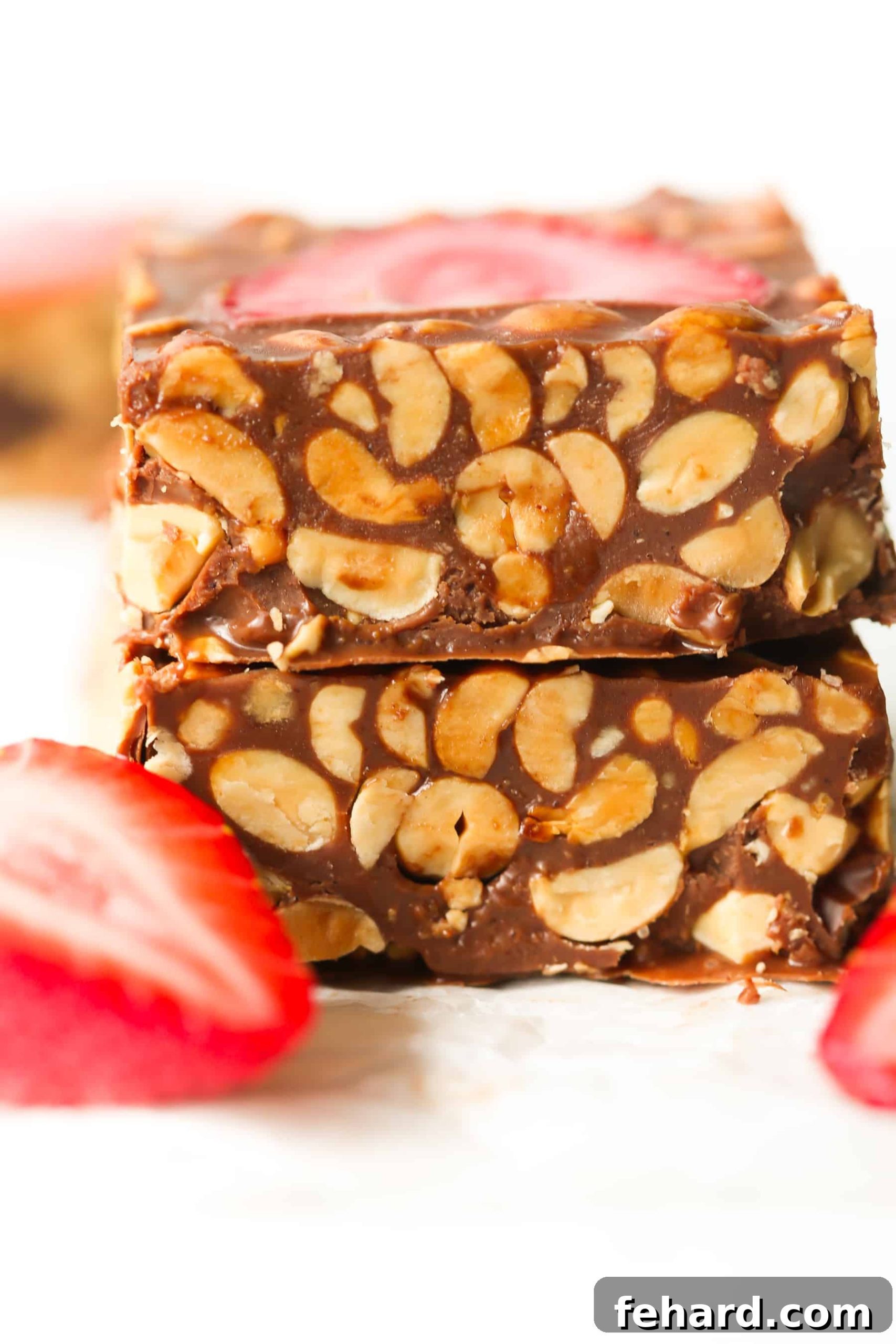 Easy Low-Carb No-Bake Chocolate Strawberry Bars for Summer A tray of no-bake chocolate strawberry bars, freshly chilled and ready to be sliced, showing the rich chocolate base and bright strawberry topping.