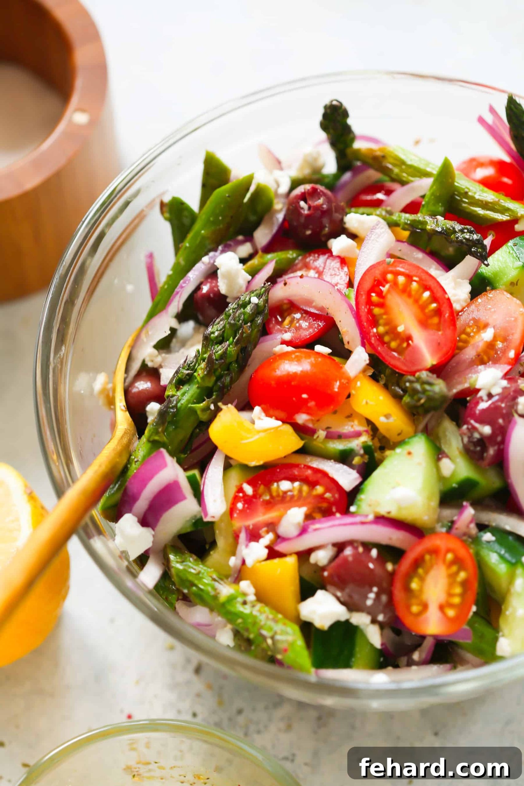 Asparagus Greek Chopped Salad - A beautifully arranged full bowl of the chopped salad, ready to serve.