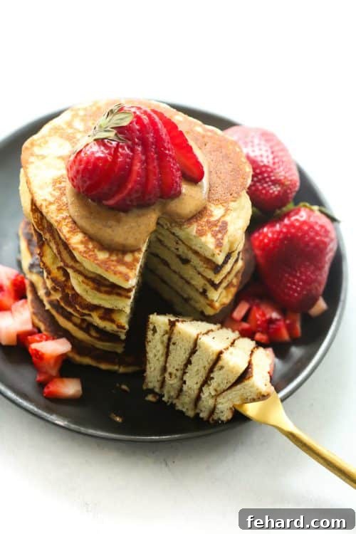Golden brown 3-Ingredient Almond Flour Pancakes on a plate with fresh berries
