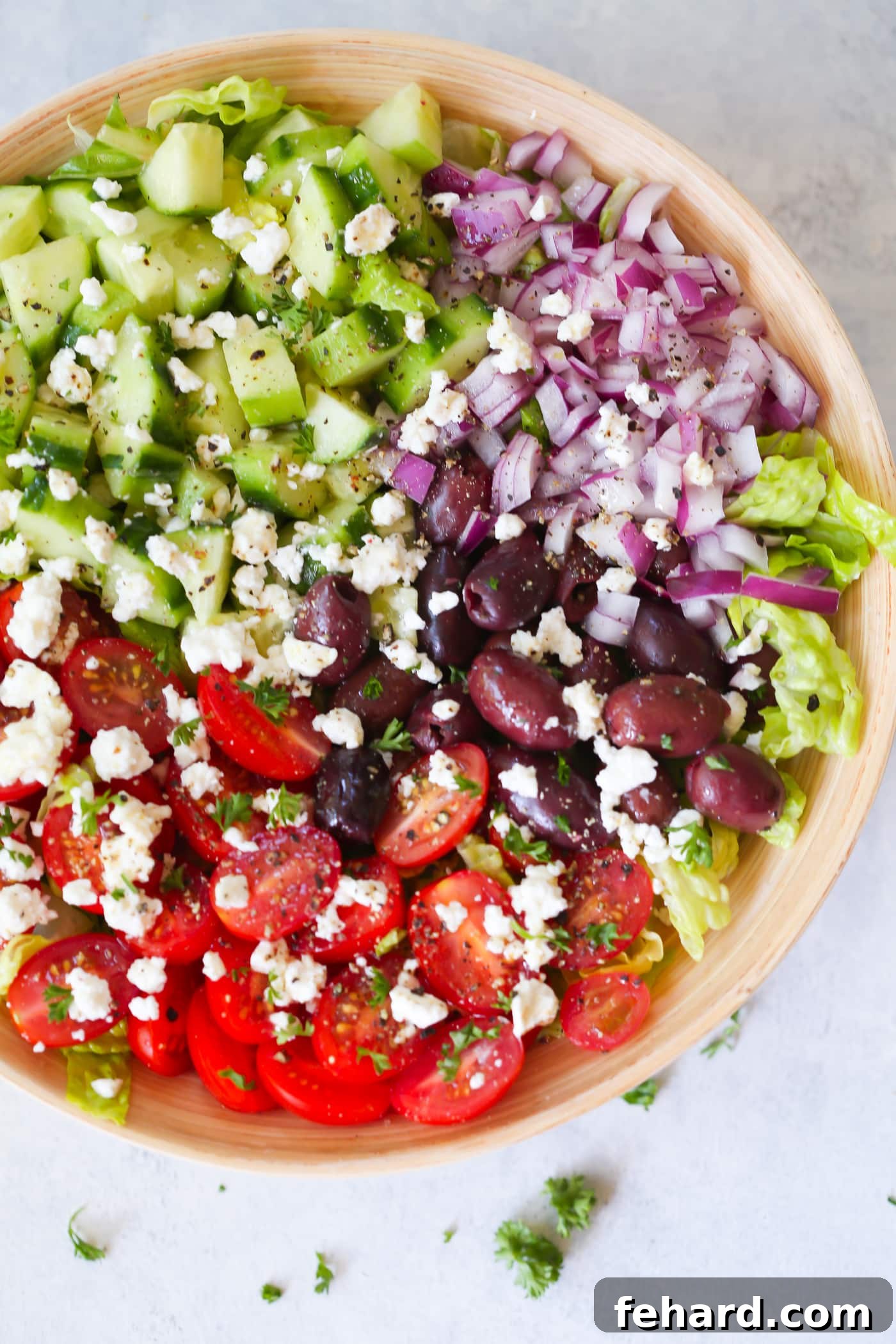 Mediterranean salad in a large bowl, showcasing fresh ingredients.
