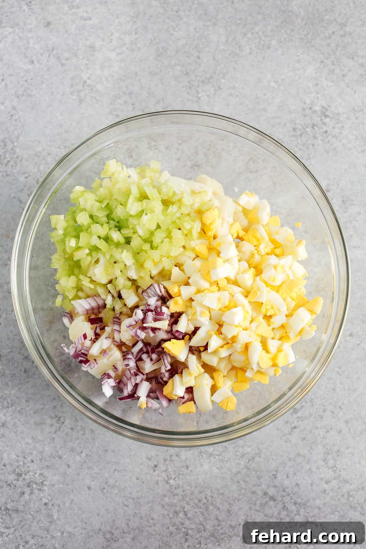 Low-Carb Cauliflower Potato Salad 4 overhead view of a glass bowl containing cauliflower potato salad