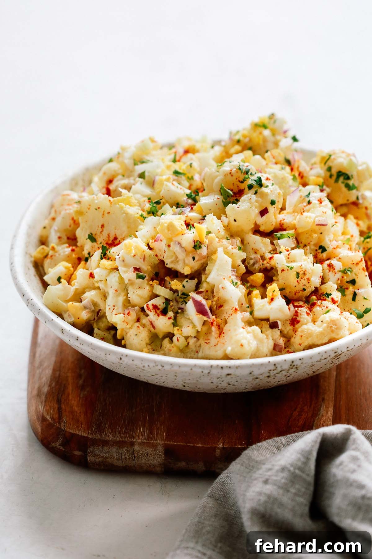 Low-Carb Cauliflower Potato Salad 8 Overhead shot of cauliflower potato salad on grey background