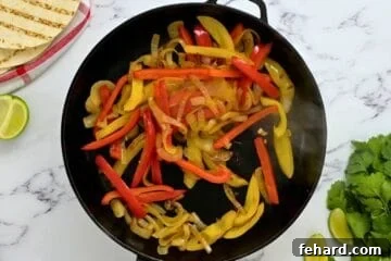Yellow and red sweet bell peppers sauteed with onions for base of fajitas.