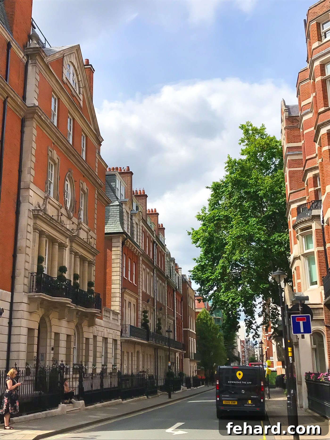 A picturesque street lined with classic, elegant buildings in London