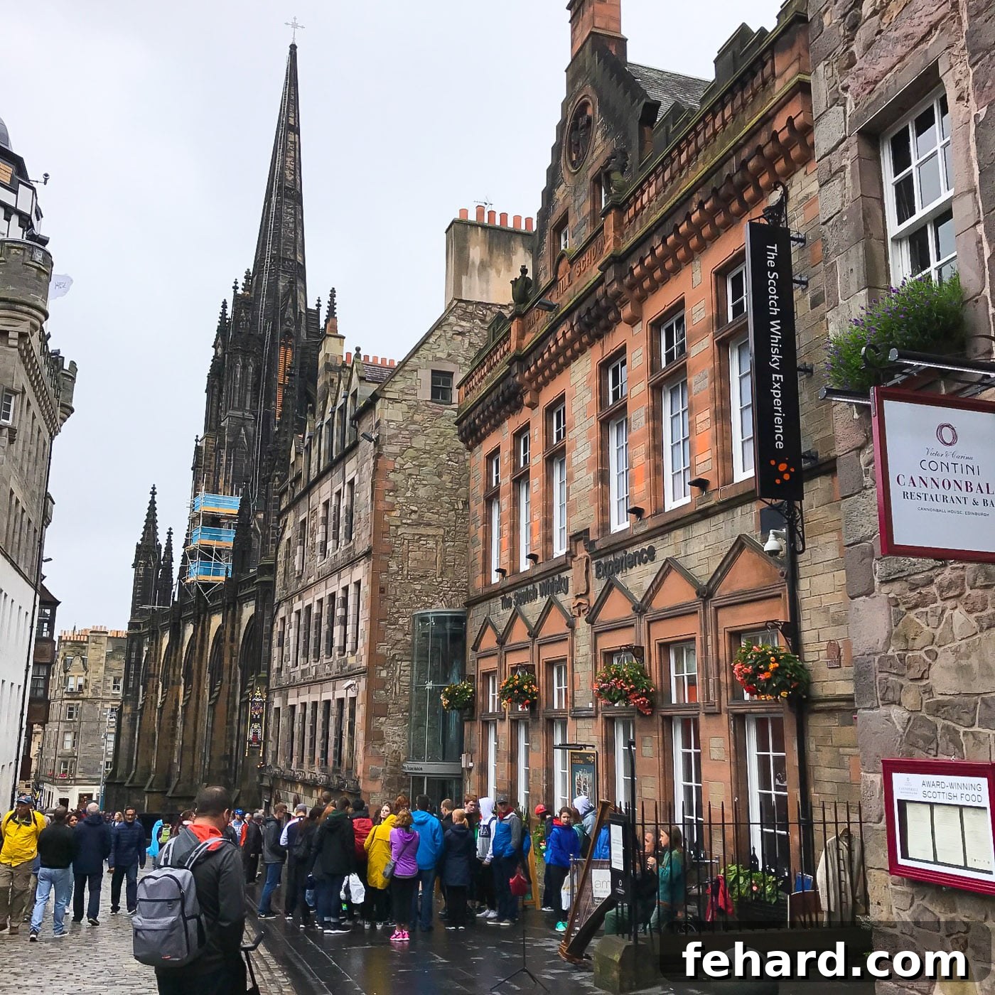 An atmospheric view of a cobbled street with elegant buildings in Edinburgh