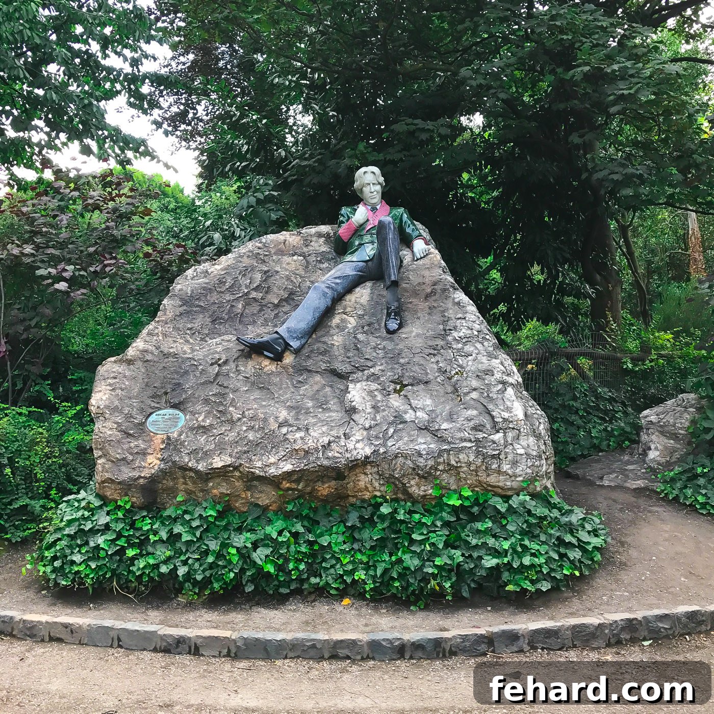 A captivating view of the lifelike statue within the Oscar Wilde Memorial Park in Dublin