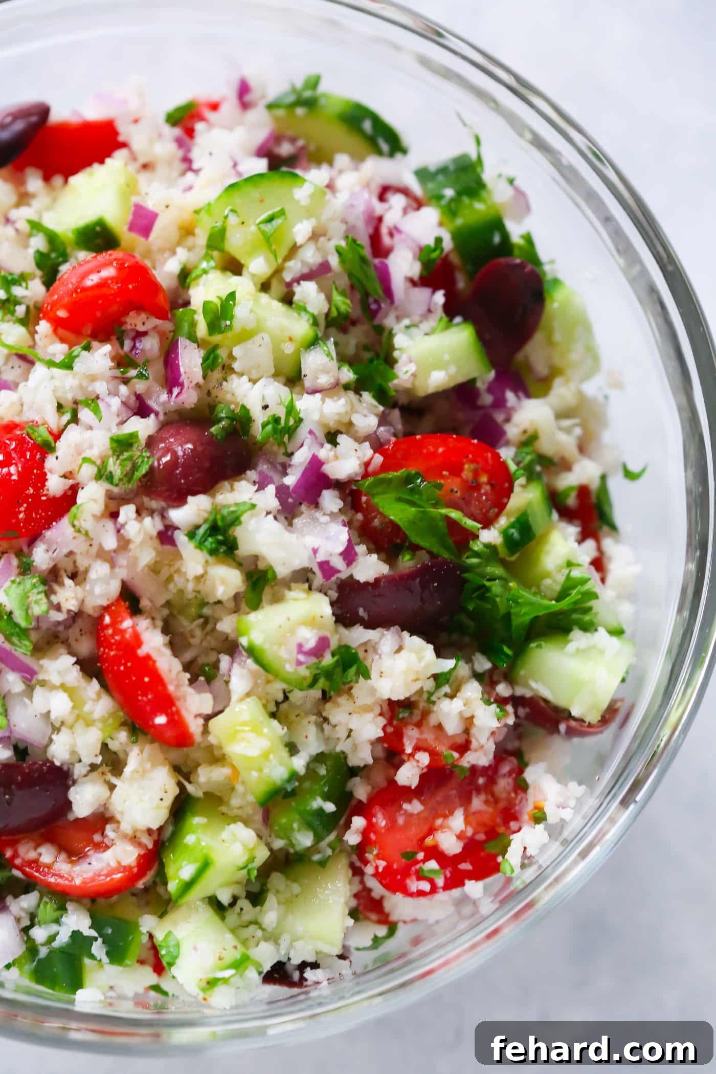 Overhead shot of Mediterranean Cauliflower Salad, highlighting its vibrant colors and fresh ingredients. A perfect healthy side dish or light meal.