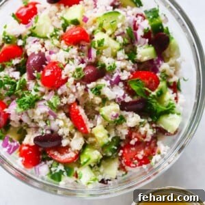 Sun-Kissed Mediterranean Cauliflower Salad 2 A glass bowl containing cauliflower mediterranean salad.