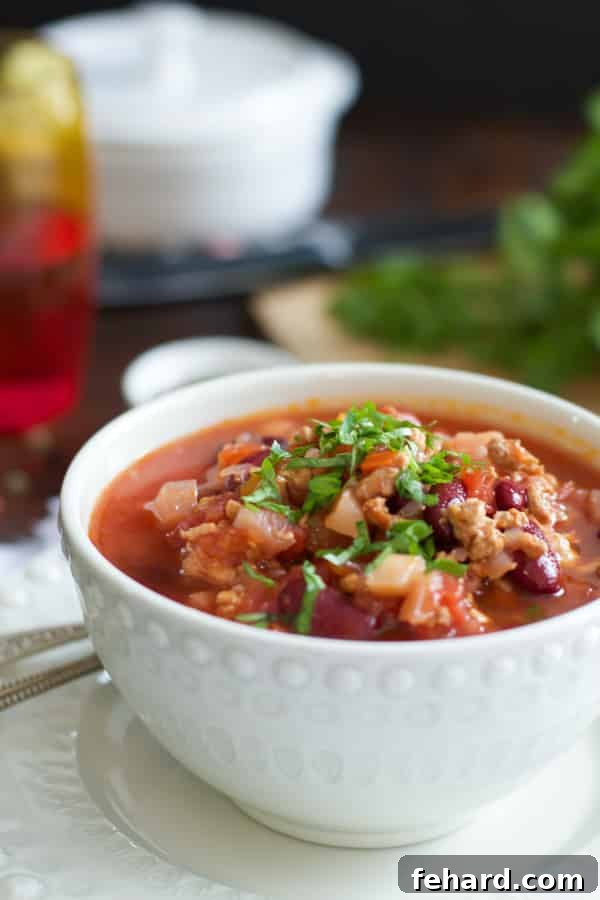Slow Cooker Beet Chili A Bowl of Rich Slow Cooker Beet Chili with Green Onions