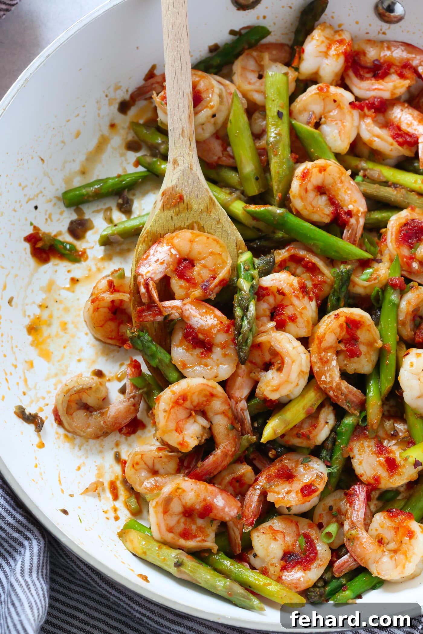 A beautifully plated Sun-dried Tomato Pesto Shrimp and Asparagus Skillet, showcasing a complete meal with rich colors and textures, ready to be enjoyed.