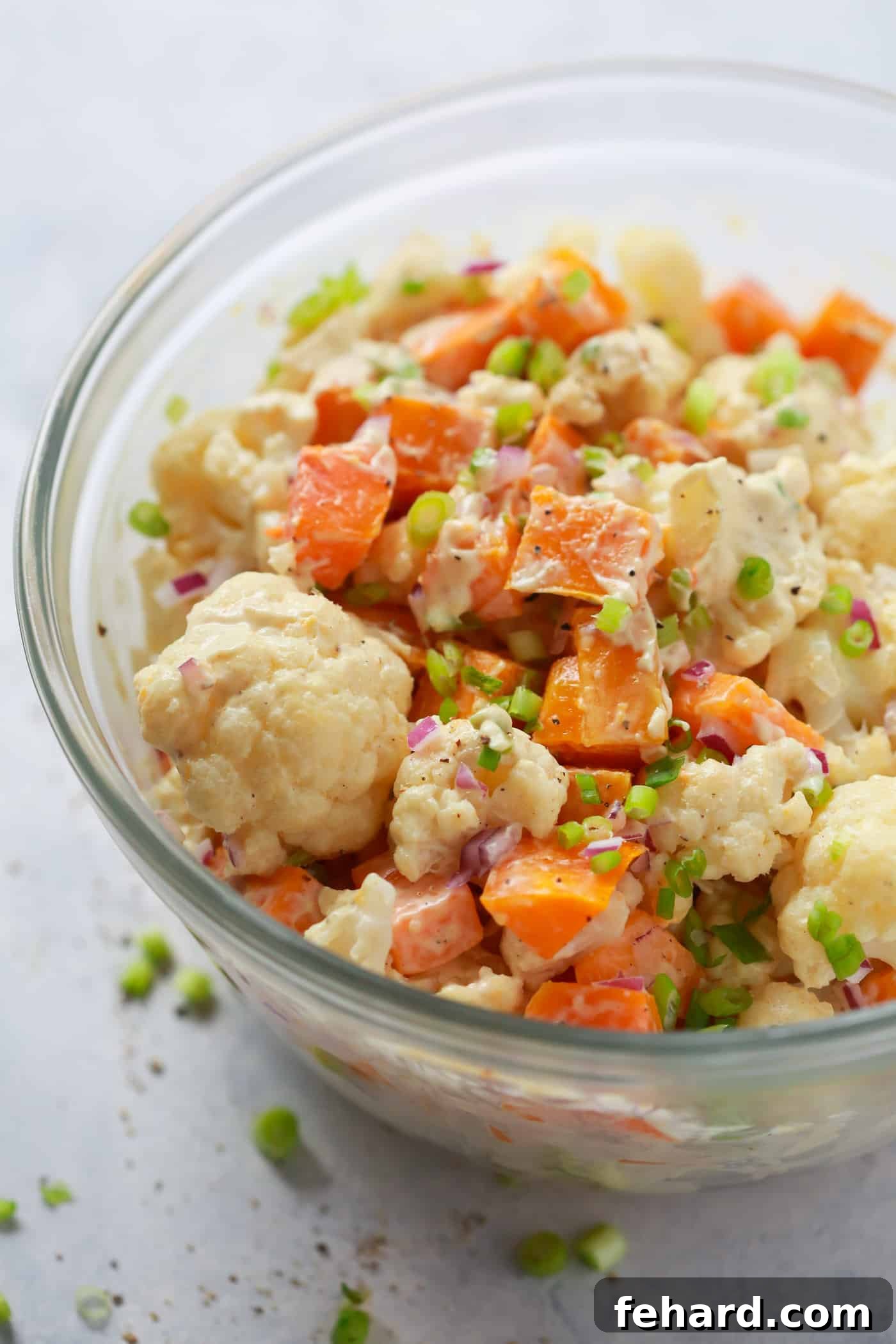 A close-up of the Roasted Butternut Squash Cauliflower Salad, showing texture and color.