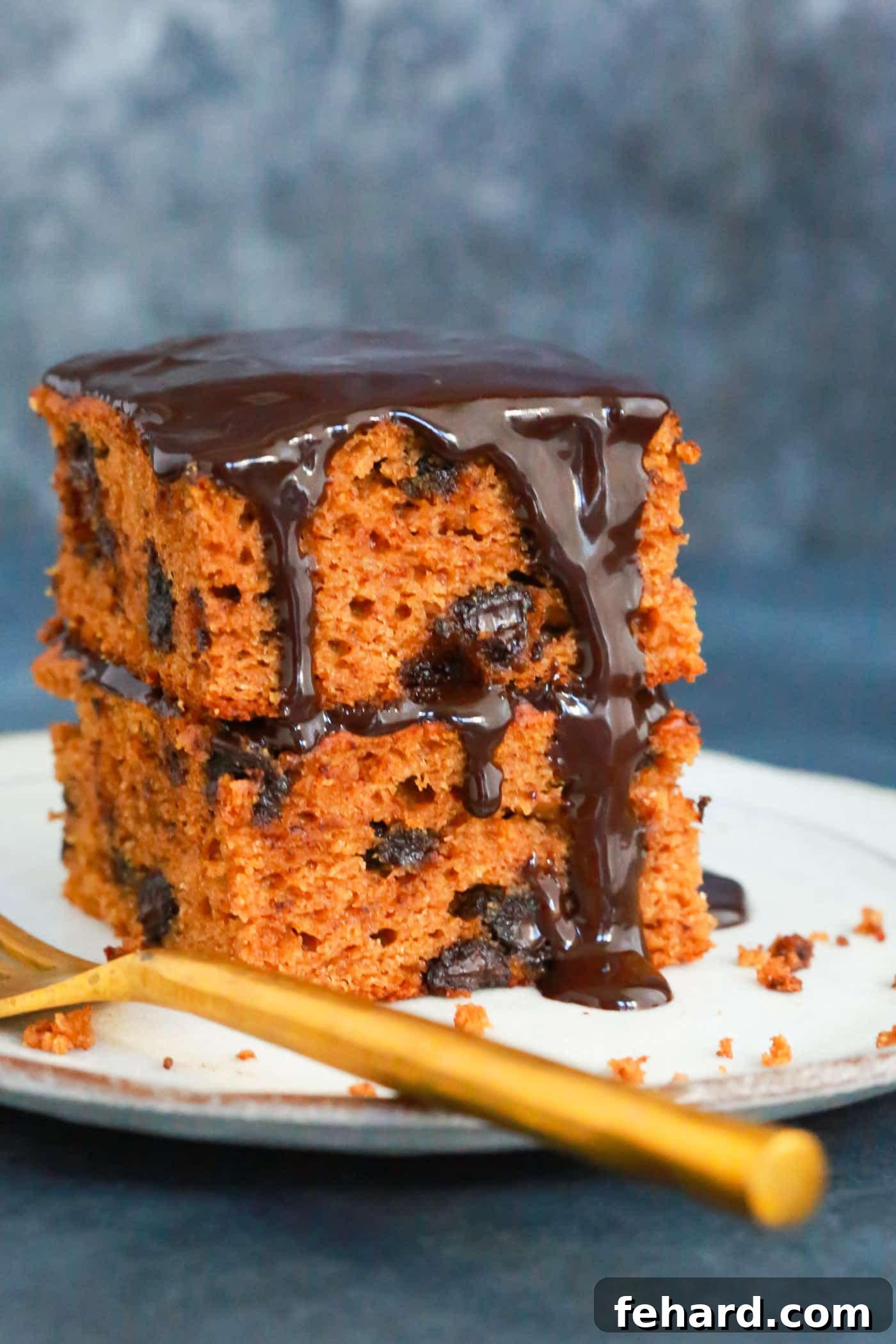 Close-up of the chocolate pumpkin cake, showing the rich chocolate frosting and pumpkin-colored cake layers.