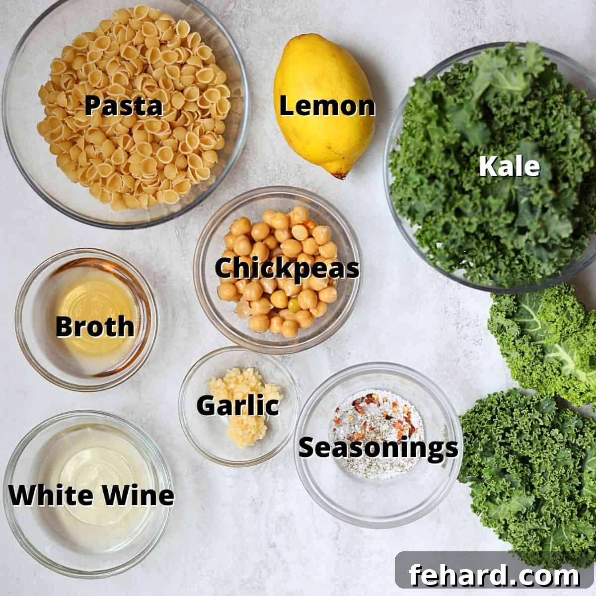 Ingredients for Kale Pasta labeled on white counter.